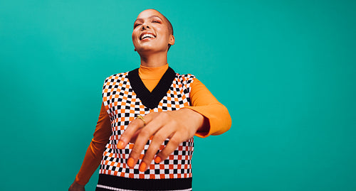 Young woman feeling cheerful in a studio