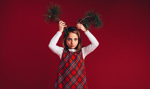 Portrait of a girl playing with twigs