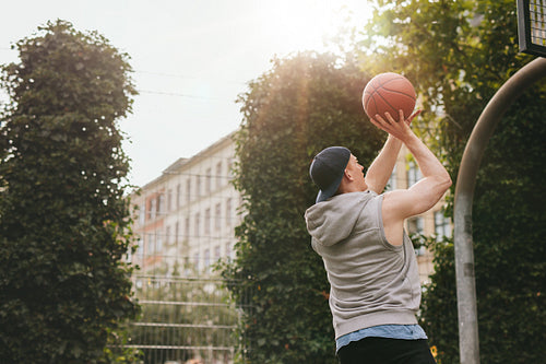 Streetball player playing on outdoor court