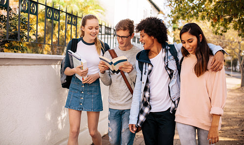 University students with books in college campus