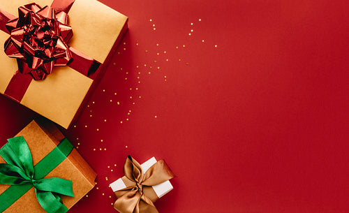 Heap of gift boxes and stars confetti with copy space