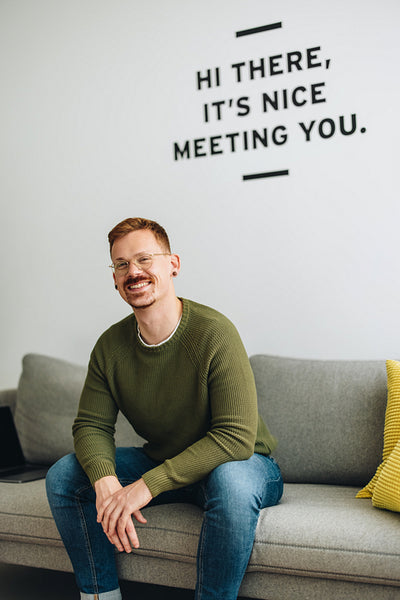 Freelancer on sofa in co-working space