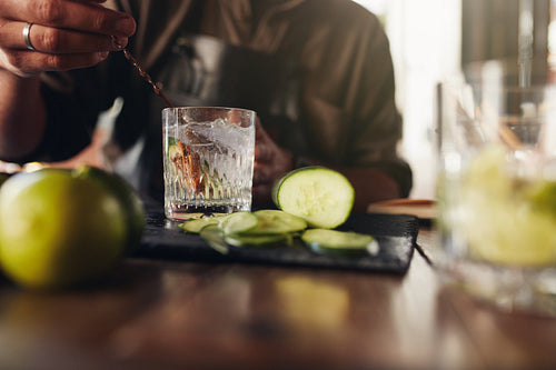 Bartender stirring a cocktail