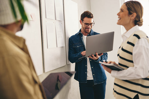 Happy business team having a meeting in a creative office