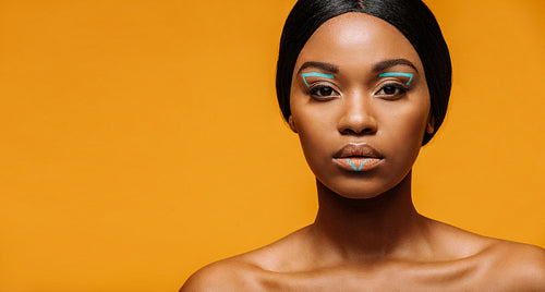 Beautiful woman with creative fashion makeup