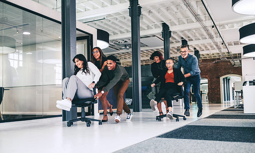 Team of businesspeople having fun together in an office