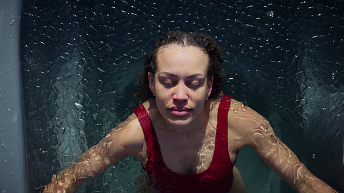 Woman doing ice bath cold plunge