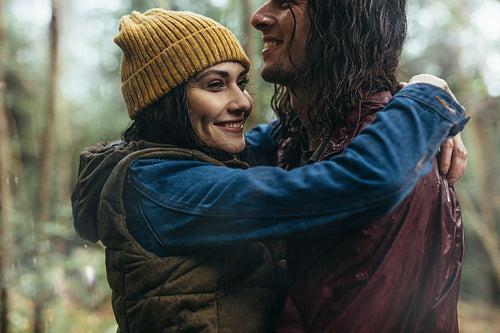 Loving couple under the rain