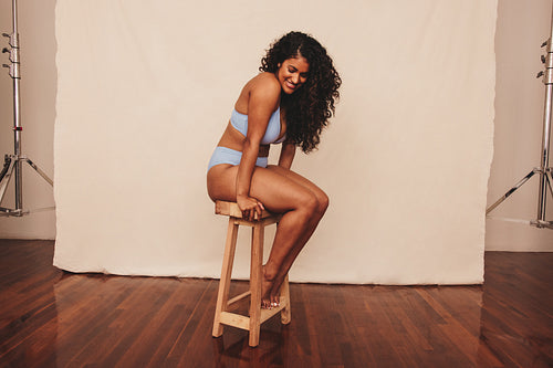 Smiling young woman feeling comfortable in her natural body