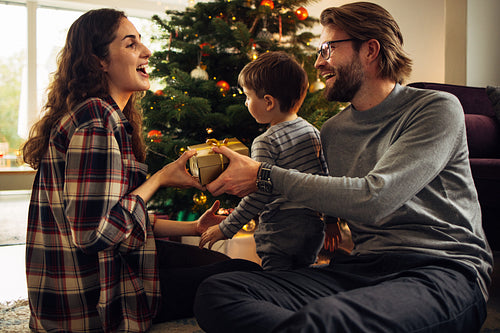 Woman receiving a gift for Christmas