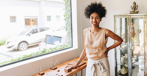 Confident businesswoman in jewelry studio