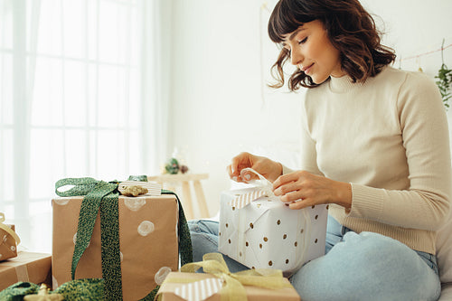 Woman making christmas gifts for family and friends