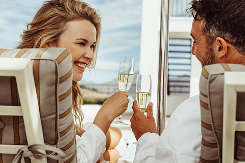 Smiling couple relaxing in a luxury villa