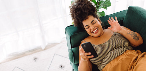 Woman having video call with her cell phone