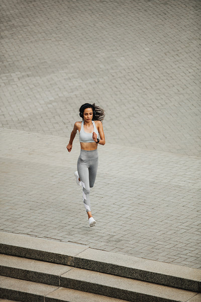 Fit woman sprinting in the city