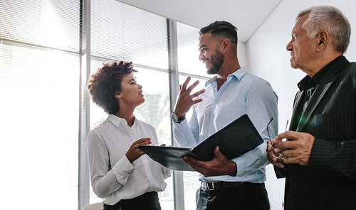 Business people talking over new business plan