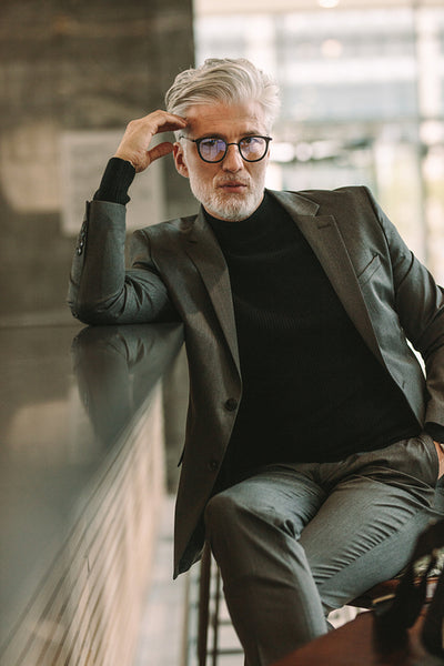 Mature businessman sitting at cafe