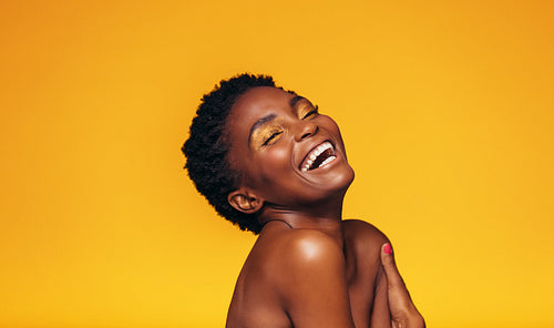 Laughing african female model with makeup
