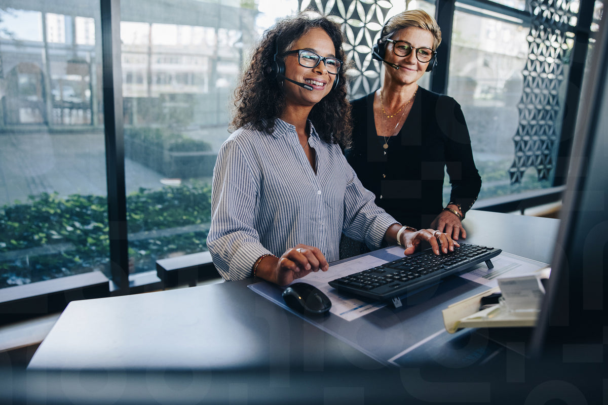 Two business professionals working together in office – Jacob Lund ...