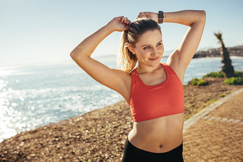 Fitness woman doing workout at the beach