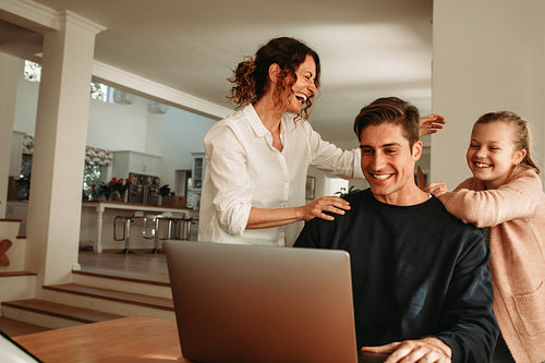 Happy family at home making video call