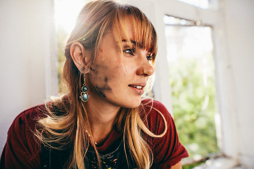 Female painter looking away