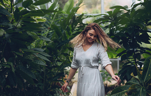 Female model enjoying in greenhouse