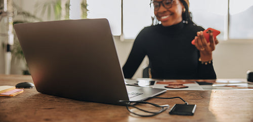 Happy creative designer taking a phone call