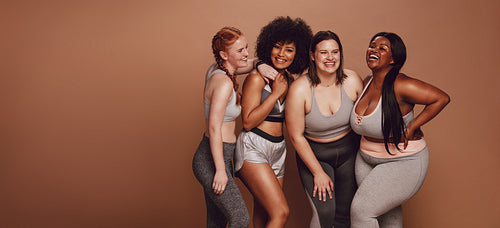 Different sized woman laughing together