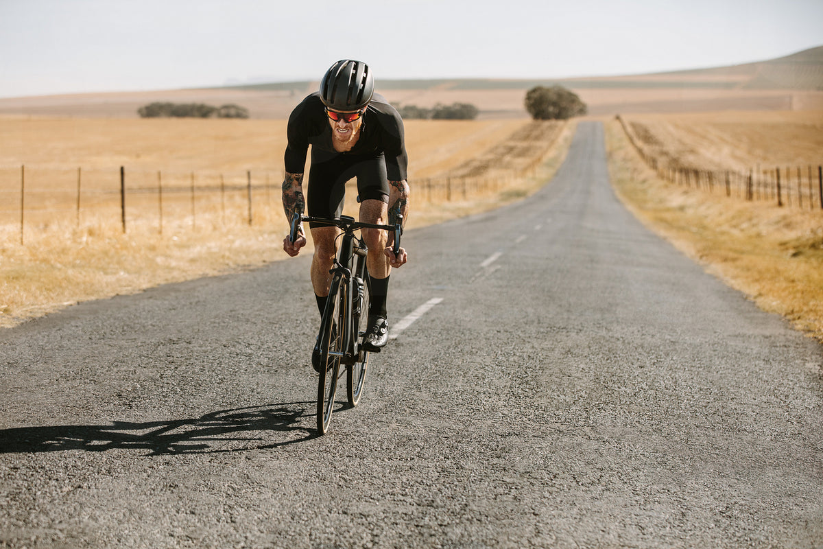 Racer riding hard on a bicycle – Jacob Lund Photography Store- premium ...