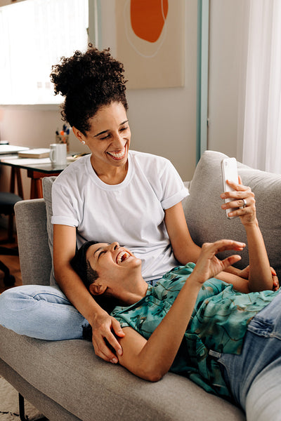 Couple laughing at some online content