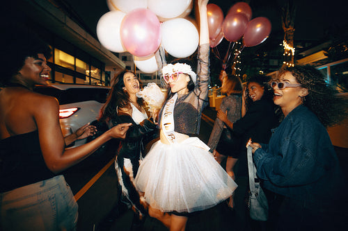 Celebratory night out with friends and festive balloons at a bachelorette party
