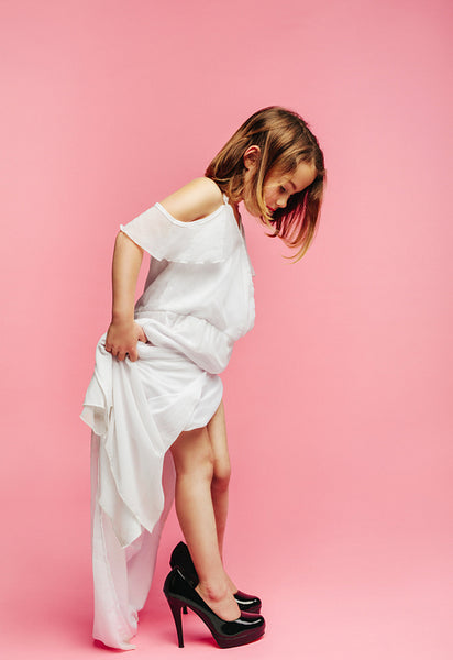 Girl pretending to be grown-up lady