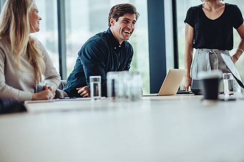 Team of professionals having friendly discussion