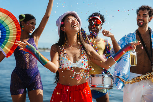 Festival party on the beach with color confetti