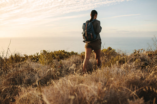 Woman walking on a mountain trail