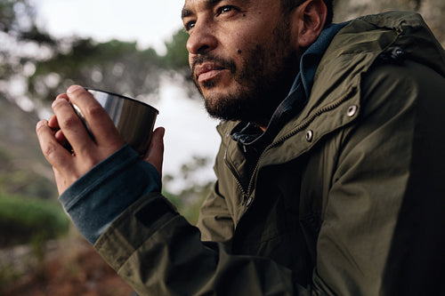 Hiker taking rest and drinking fresh coffee