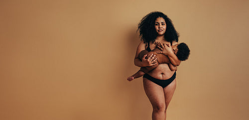 African mother breastfeeding her baby