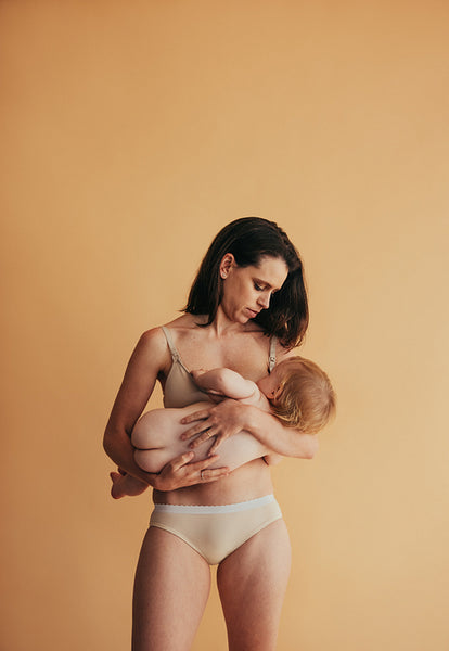 Woman feeding her baby