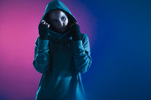 Fitness girl in hooded shirt