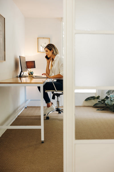 Young businesswoman having a phone call in her office