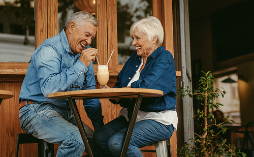Senior couple having great time at cafe