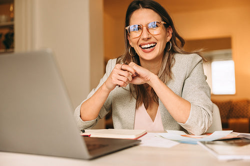 Successful interior designer working in her home office