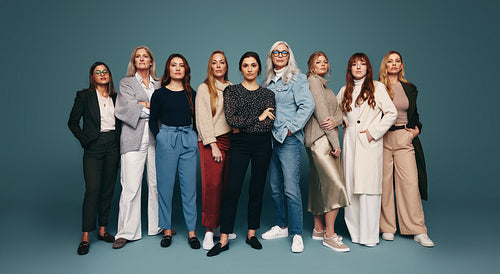 Group of strong independent women standing in a studio