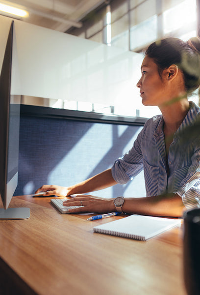 Businesswoman working at her office desk