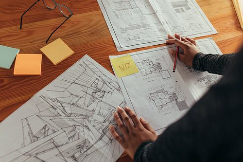Designer working on building floor plan
