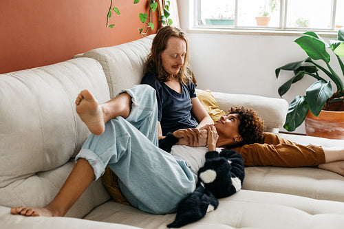 Family enjoying a relaxed day at home on the couch