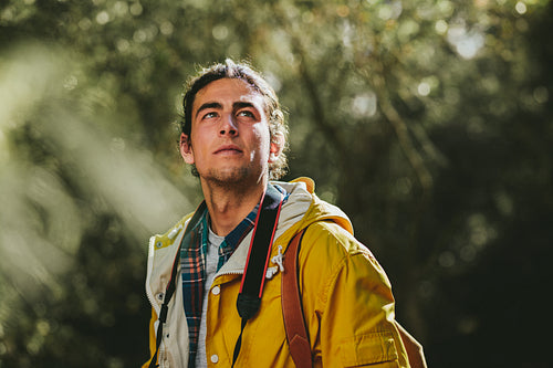 Portrait of a hiker standing in a forest