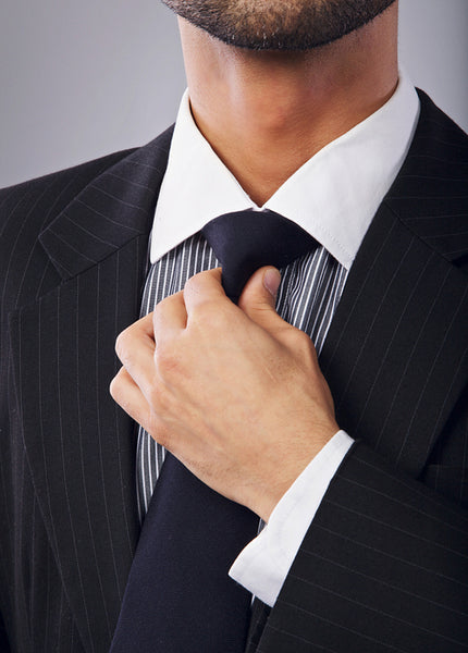 White Collar Worker Adjusting His Necktie