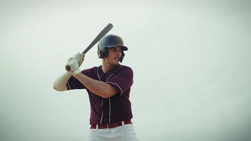 Baseball batter practices his swings with power